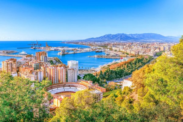 Malaga aerial cityscape, Costa del Sol, Andalusia, Spain - Sea cargo port in Mediterranean sea.