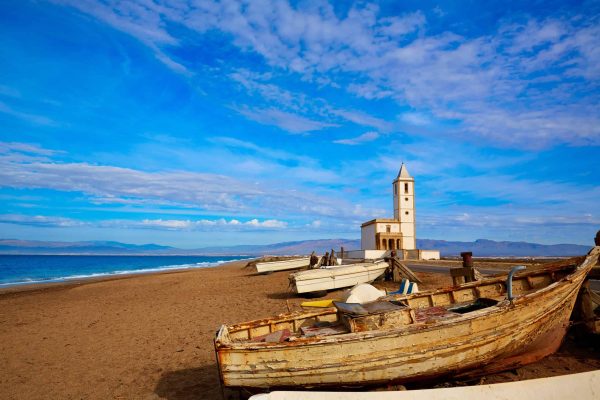 Cabo de Gata in Almeria at San Miguel Beach and Salinas church with stranded boats